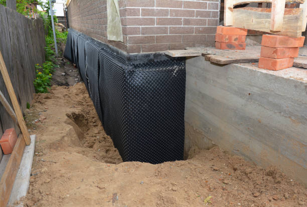 Happy homeowners after waterproofing job in North Star